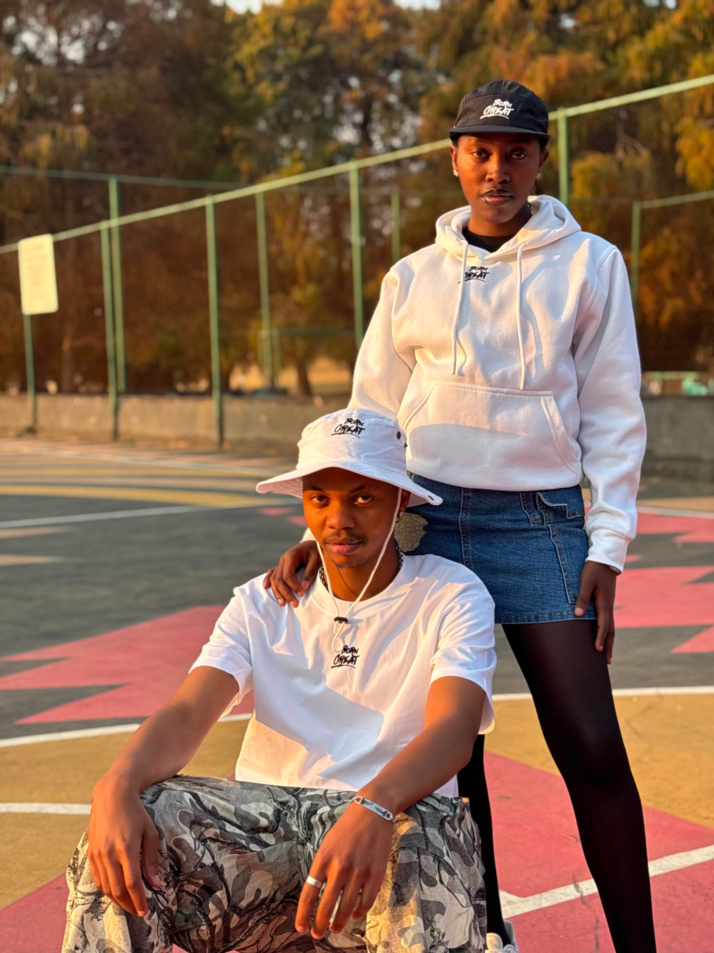 Friends in white Born Great hoodie and tee on the court